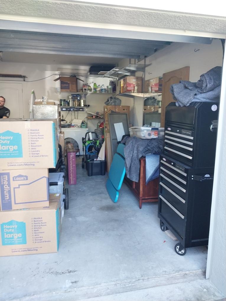 Loaded moving truck parked in a driveway