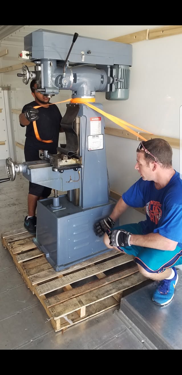 Specialty industrial equipment being moved inside a truck